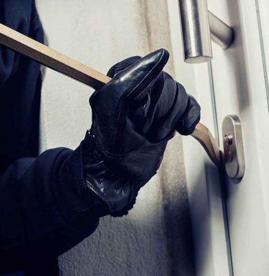 burglar-using-crowbar-break-home-door-night