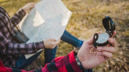 close-up-hiker-with-compass-his-hand