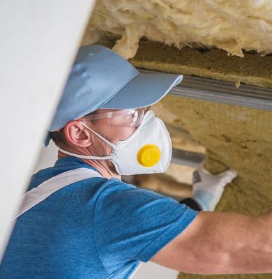 man-insulating-house