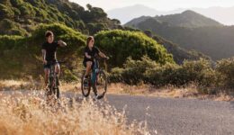 close-up-couple-with-electric-bikes