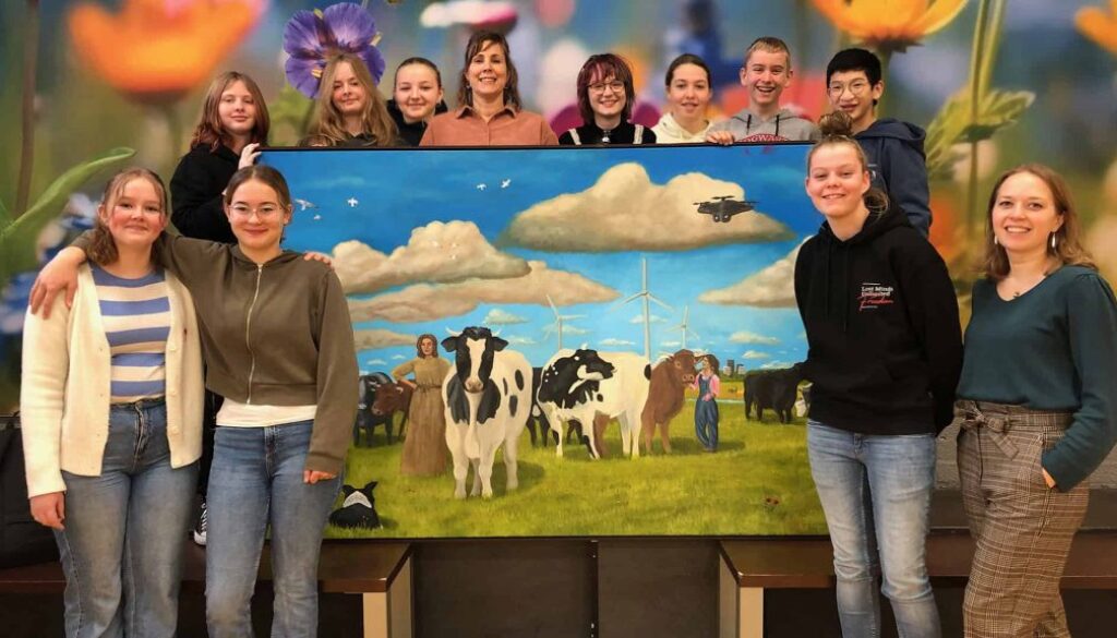 Foto met schilderij leerlingen en docenten