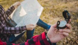 close-up-hiker-with-compass-his-hand