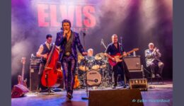Elvis Presley tribute band performing live on stage at RTV SLOS, capturing the iconic rock 'n' roll style.